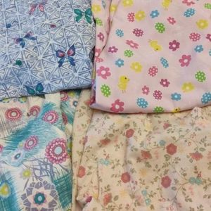 Bundle of four scrub tops size 2XL.